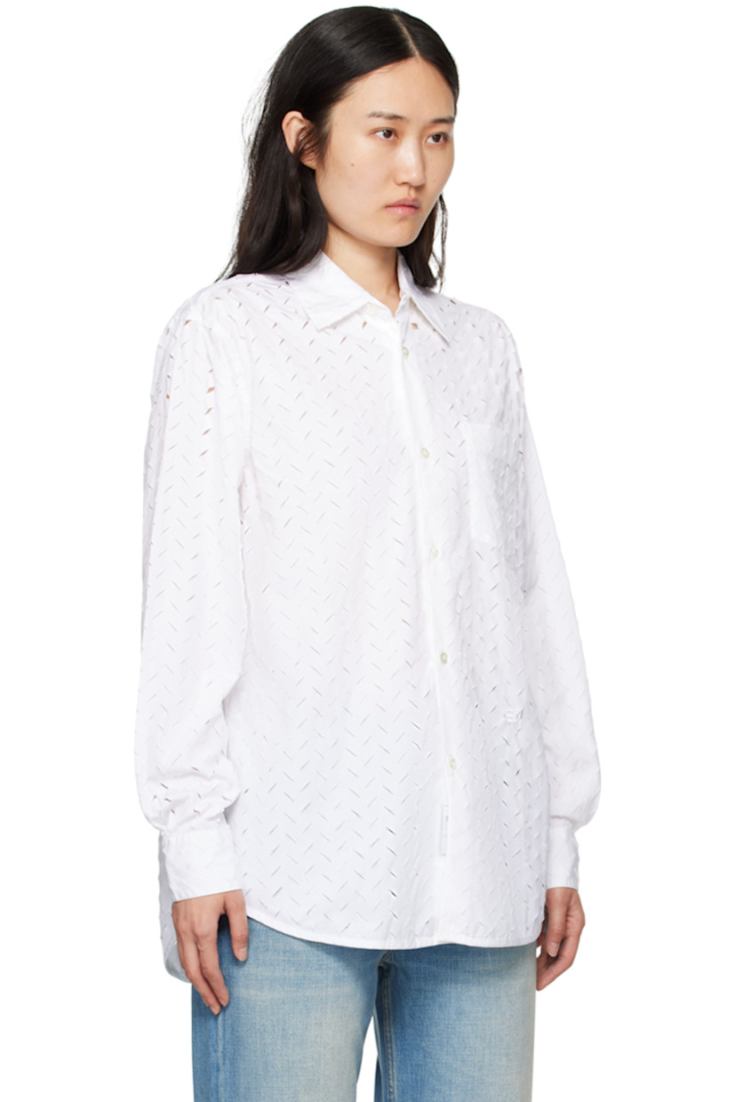 Cotton poplin shirt. Laser-cut distressed herringbone pattern throughout.

· Spread collar
· Button closure
· Patch pocket
· Logo embroidered at front
· Shirttail hem
· Single-button barrel cuffs
· Box pleat at back yoke

Supplier color: White
