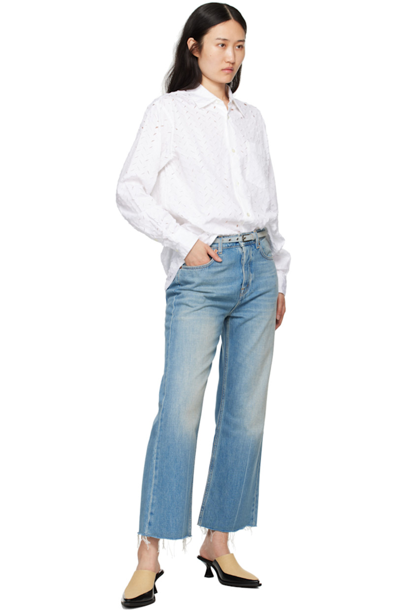 Cotton poplin shirt. Laser-cut distressed herringbone pattern throughout.

· Spread collar
· Button closure
· Patch pocket
· Logo embroidered at front
· Shirttail hem
· Single-button barrel cuffs
· Box pleat at back yoke

Supplier color: White