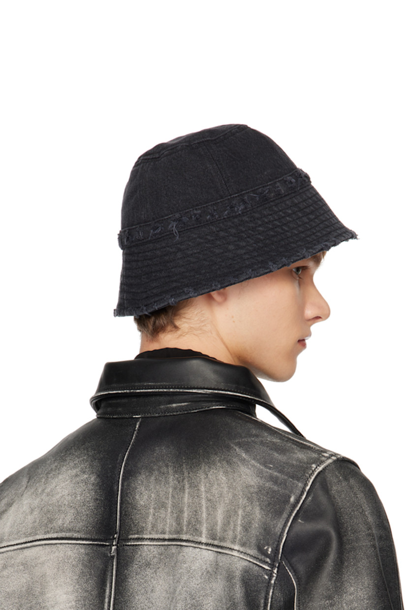 Non-stretch denim bucket hat in black.

· Fading and distressing throughout
· Logo plaque at face
· Quilted brim
· Poplin lining

Supplier color: Stone black