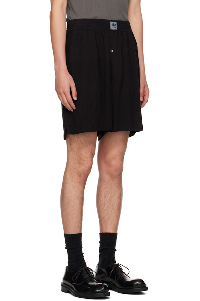 Plain-woven cupro shorts.

· Rubberized logo patch at elasticized waistband
· Three-pocket styling
· Button-fly
· Vented outseams

Supplier color: Black