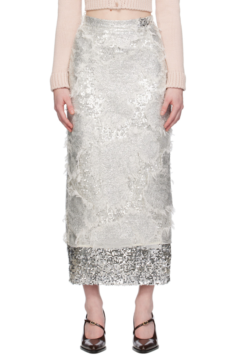 Sequinned nylon tulle and viscose mesh skirt. Frayed edges and fishnet detailing throughout.

· Layered construction
· Concealed zip closure at back
· Central vent at back hem
· Full acetate- and silk-blend georgette lining

Supplier color: Silver