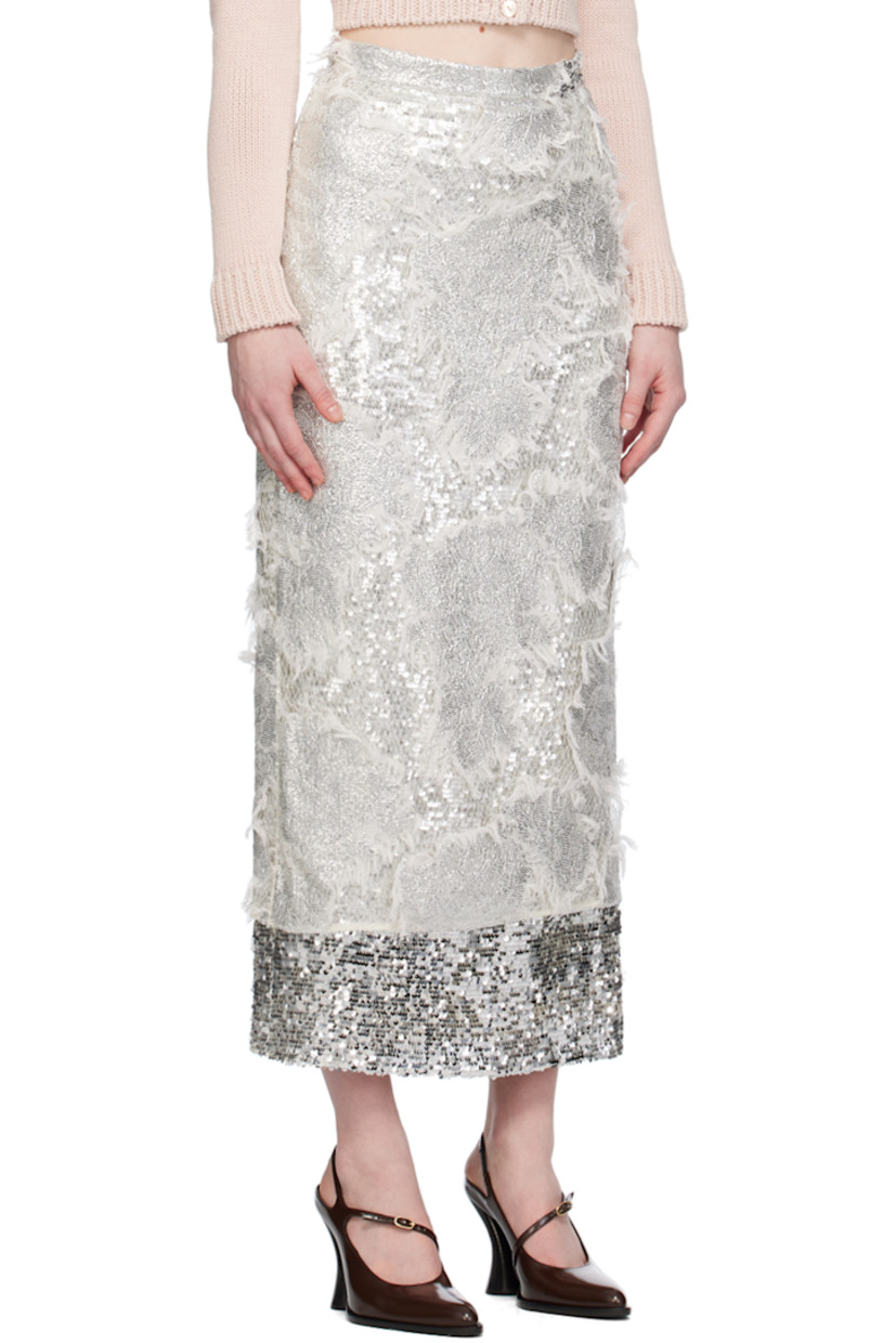 Sequinned nylon tulle and viscose mesh skirt. Frayed edges and fishnet detailing throughout.

· Layered construction
· Concealed zip closure at back
· Central vent at back hem
· Full acetate- and silk-blend georgette lining

Supplier color: Silver
