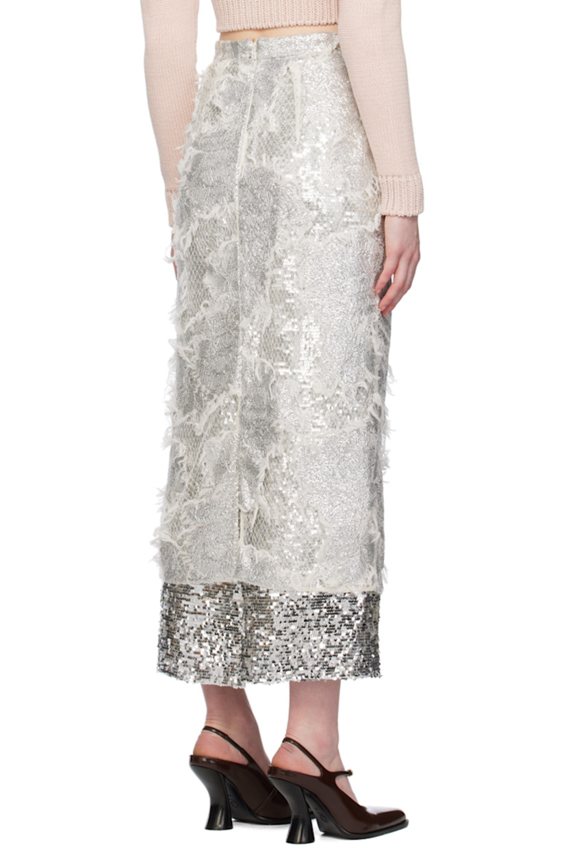 Sequinned nylon tulle and viscose mesh skirt. Frayed edges and fishnet detailing throughout.

· Layered construction
· Concealed zip closure at back
· Central vent at back hem
· Full acetate- and silk-blend georgette lining

Supplier color: Silver
