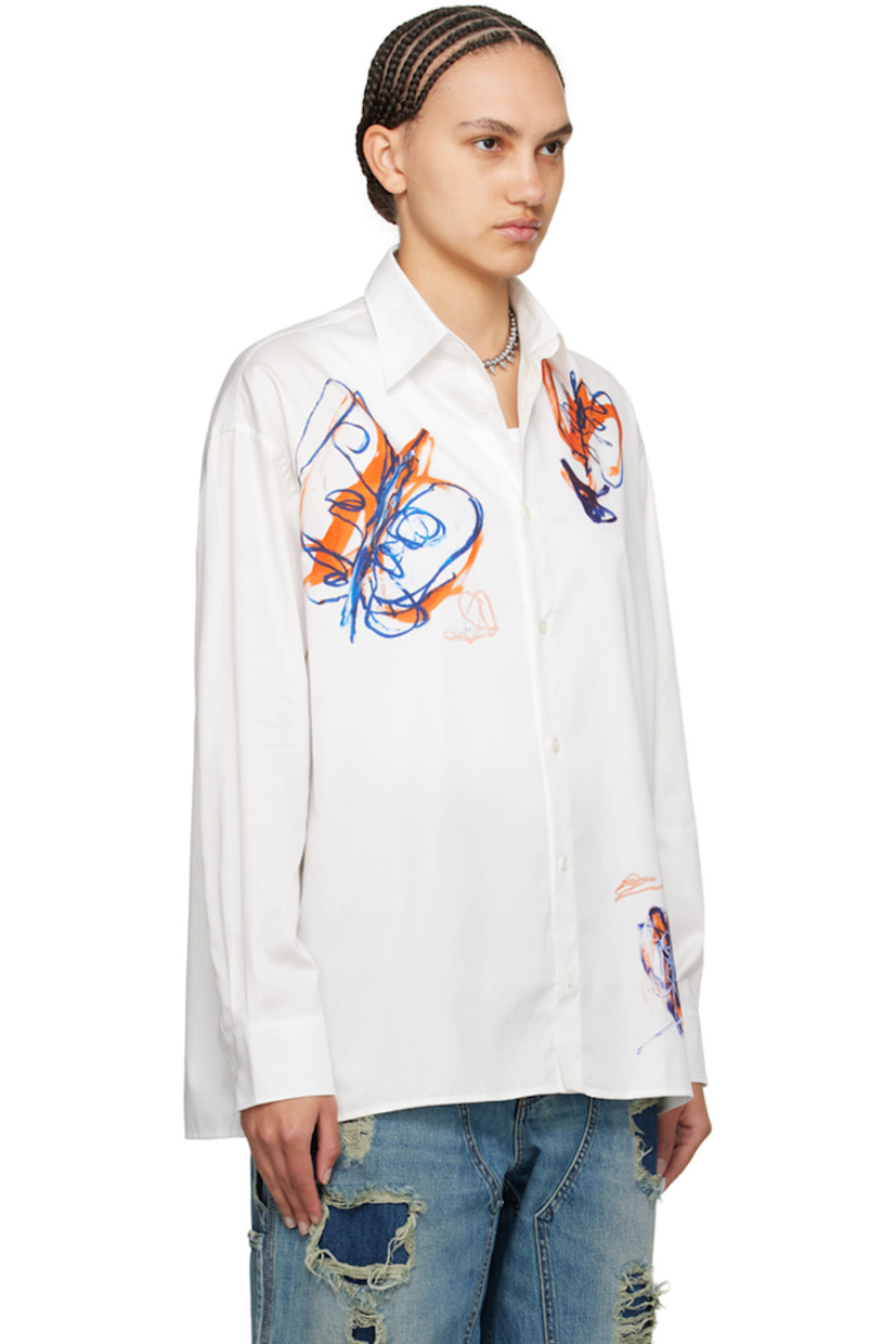 Organic cotton poplin shirt.

· Spread collar
· Button closure
· Graphics printed at front and back
· Logo-engraved silver-tone hardware at front
· Droptail hem
· Dropped shoulders
· Adjustable single-button barrel cuffs
· Pleats at cuffs

Part of the Études x Julian Farade collaboration.

Supplier color: Ete