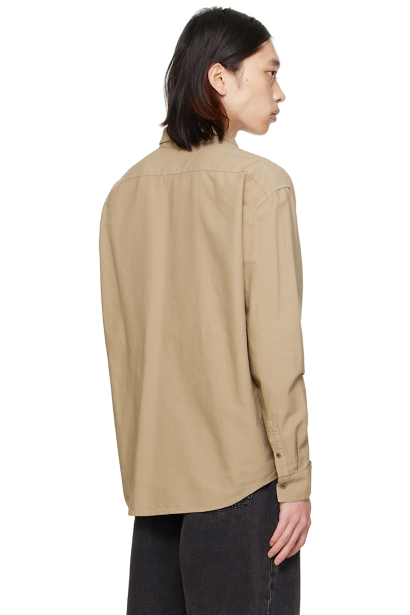Cotton broadcloth shirt.

· Spread collar
· Button closure
· Logo embroidered at chest
· Shirttail hem
· Single-button barrel cuffs
· Mother-of-pearl hardware

Supplier color: Sand