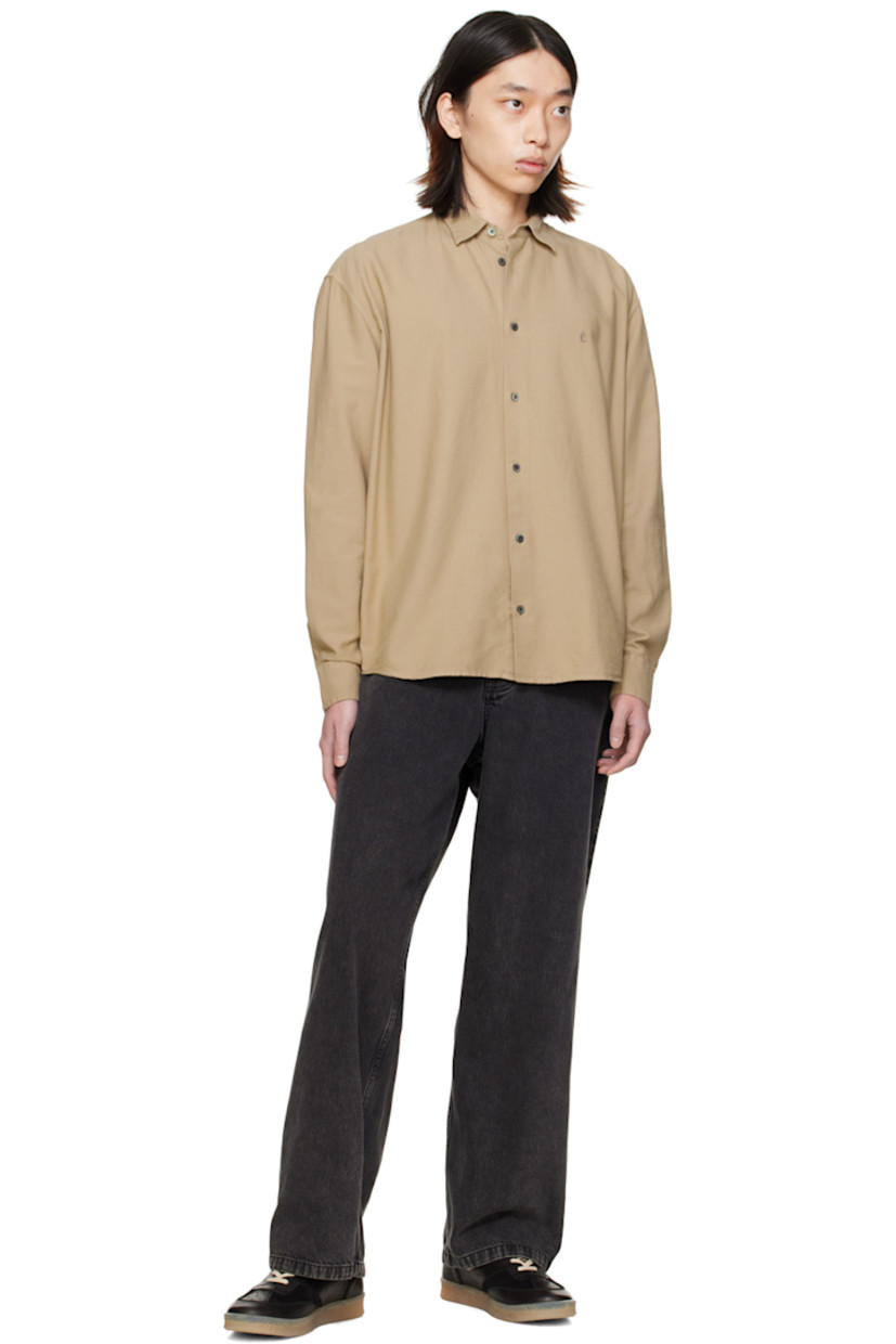 Cotton broadcloth shirt.

· Spread collar
· Button closure
· Logo embroidered at chest
· Shirttail hem
· Single-button barrel cuffs
· Mother-of-pearl hardware

Supplier color: Sand