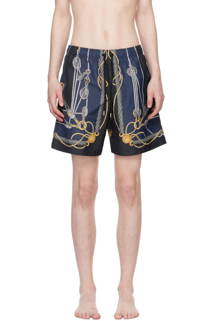 Polyester taffeta swim shorts. Logo graphic pattern printed throughout. 

· Drawstring at elasticized waistband
· Three-pocket styling
· Mock-fly
· Mesh briefs-style underlay

Supplier color: Blue/Gold
