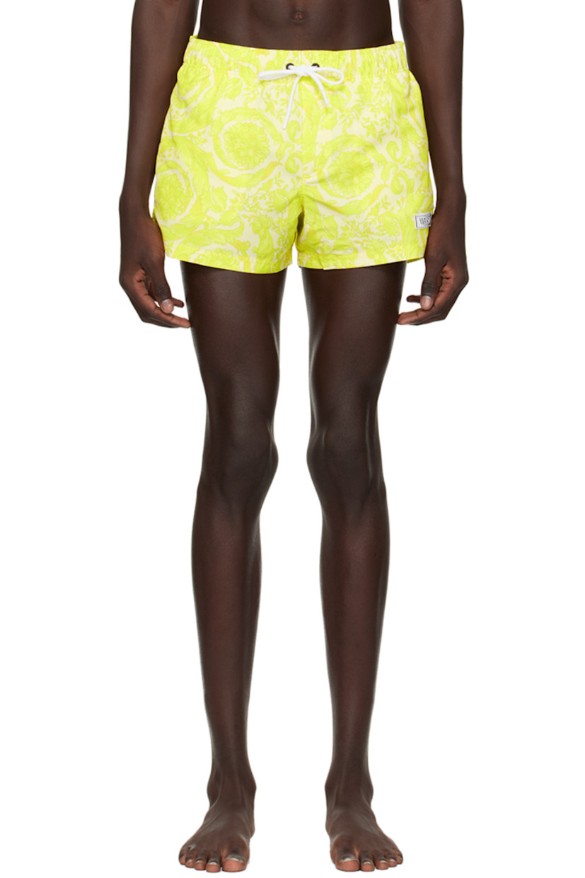 Polyester taffeta swim shorts. Barocco pattern printed throughout. 

· Drawstring at elasticized waistband 
· Three-pocket styling 
· Rubberized logo patch at front leg
· Mesh lining 

Supplier color: Mimosa