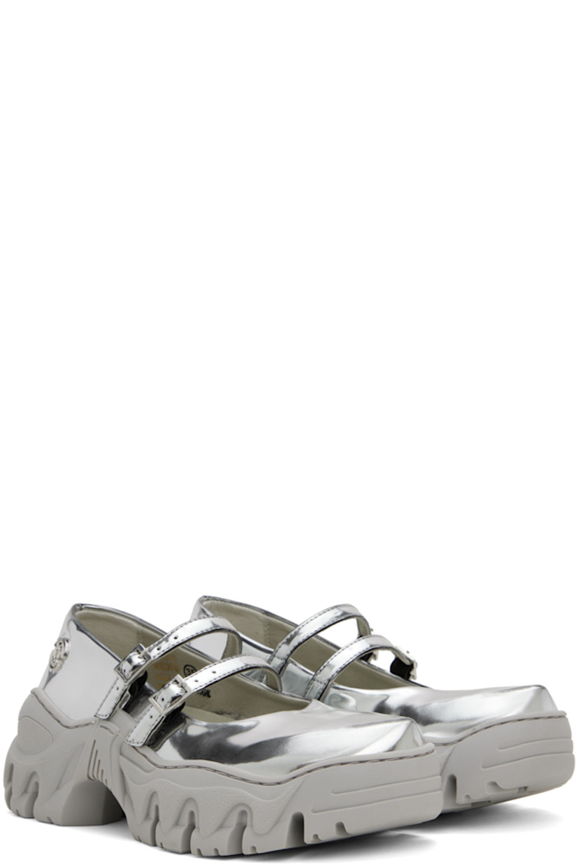 Handcrafted patent faux-leather ballerina flats in metallic silver tone.

· Pointed toe
· Pin-buckle straps at vamp
· Logo hardware at outer side
· Logo embossed at heel counter
· Sculptural TPU platform midsole
· Treaded TPU sole
· Platform: H1.5"

Available exclusively at SSENSE. 

Supplier color: Silver