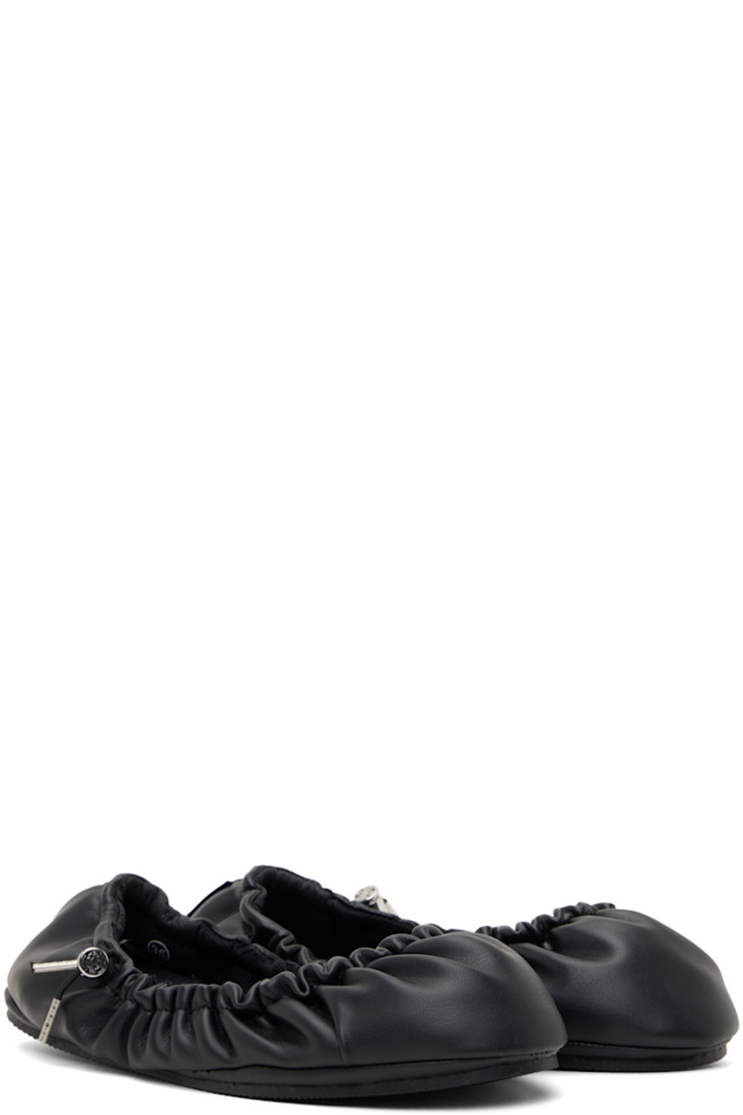 Handcrafted grained faux-leather ballerina flats in black.

· Bungee-style drawstring at collar
· Logo flag at heel
· Mesh lining
· Treaded TPU sole

Supplier color: Black beyond leather