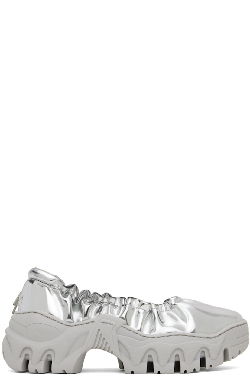 Handcrafted patent faux-leather ballerina flats in silver tone.

· Bungee-style drawstring at elasticized collar 
· Logo flag at heel tab
· Logo embossed at heel counter 
· Mesh lining
· Treaded sculptural TPU platform sole
· Platform: H2"

Available exclusively at SSENSE.

Supplier color: Brushed silver