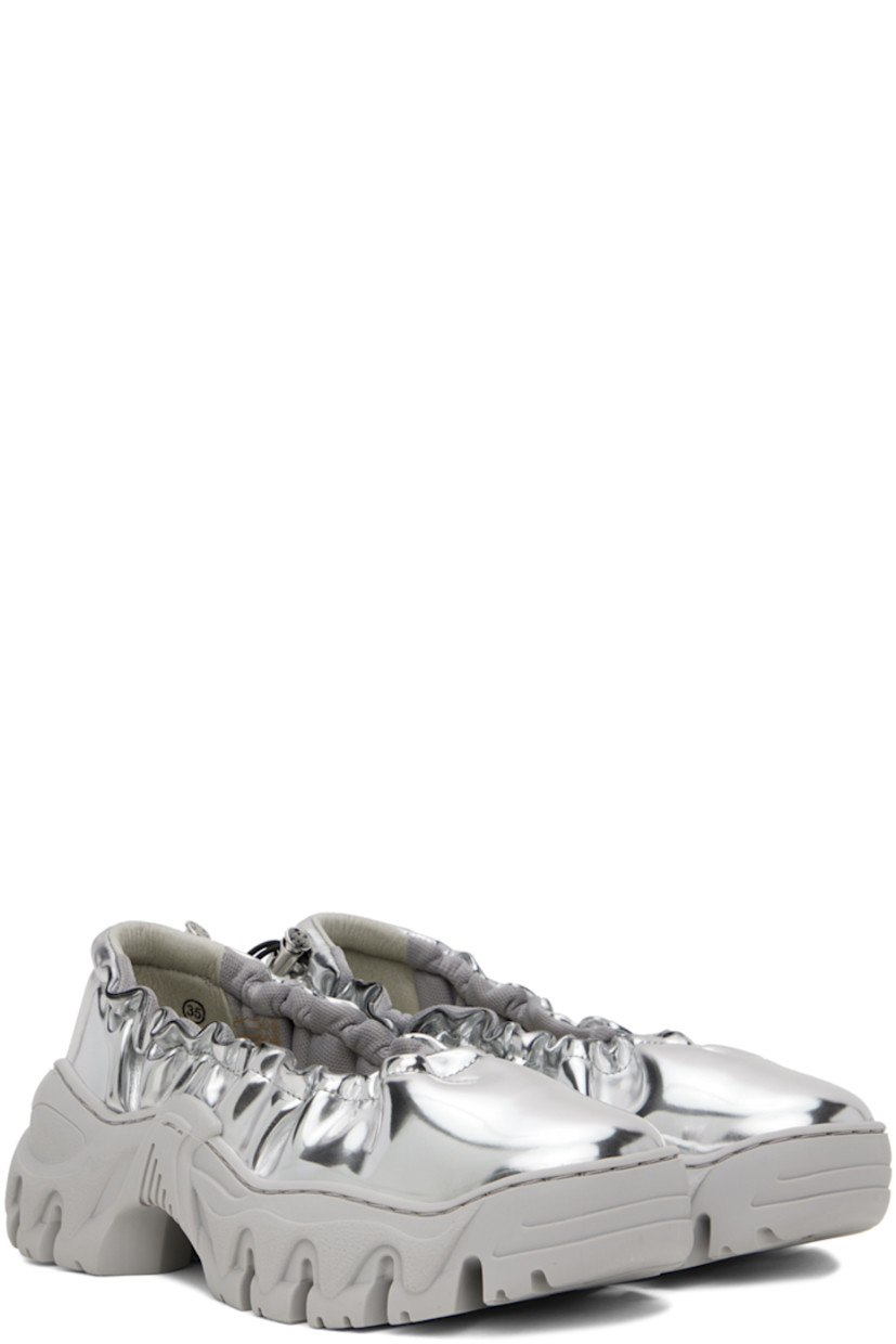 Handcrafted patent faux-leather ballerina flats in silver tone.

· Bungee-style drawstring at elasticized collar 
· Logo flag at heel tab
· Logo embossed at heel counter 
· Mesh lining
· Treaded sculptural TPU platform sole
· Platform: H2"

Available exclusively at SSENSE.

Supplier color: Brushed silver