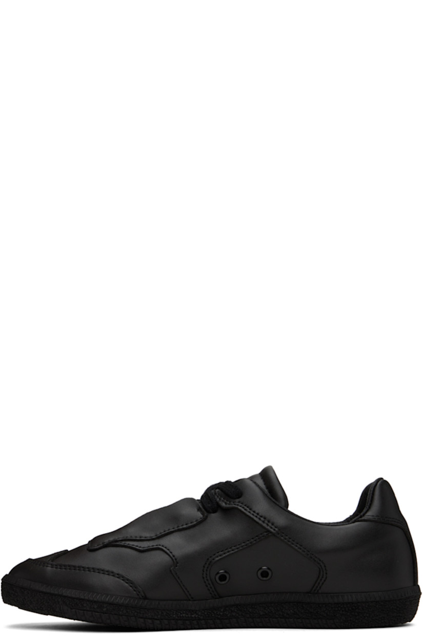 Handcrafted low-top buffed faux-leather sneakers in black.

· Lace-up closure
· Logo embossed at padded tongue and heel
· Padded collar
· Rubberized logo patch at outer side
· Eyelets at inner side
· Buffed faux-leather lining
· Treaded TPU sole

Supplier color: Black beyond leather