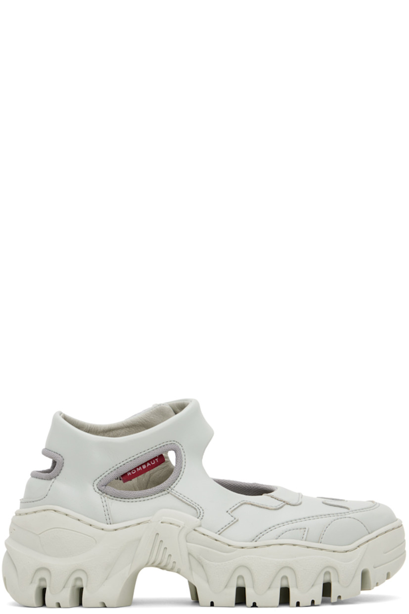 Handcrafted low-top paneled buffed faux-leather sneakers in gray.

· Velcro ankle strap
· Cutout at heel and outer side
· Mesh lining
· Treaded sculptural TPU platform sole
· Platform: H2"

Supplier color: Light grey