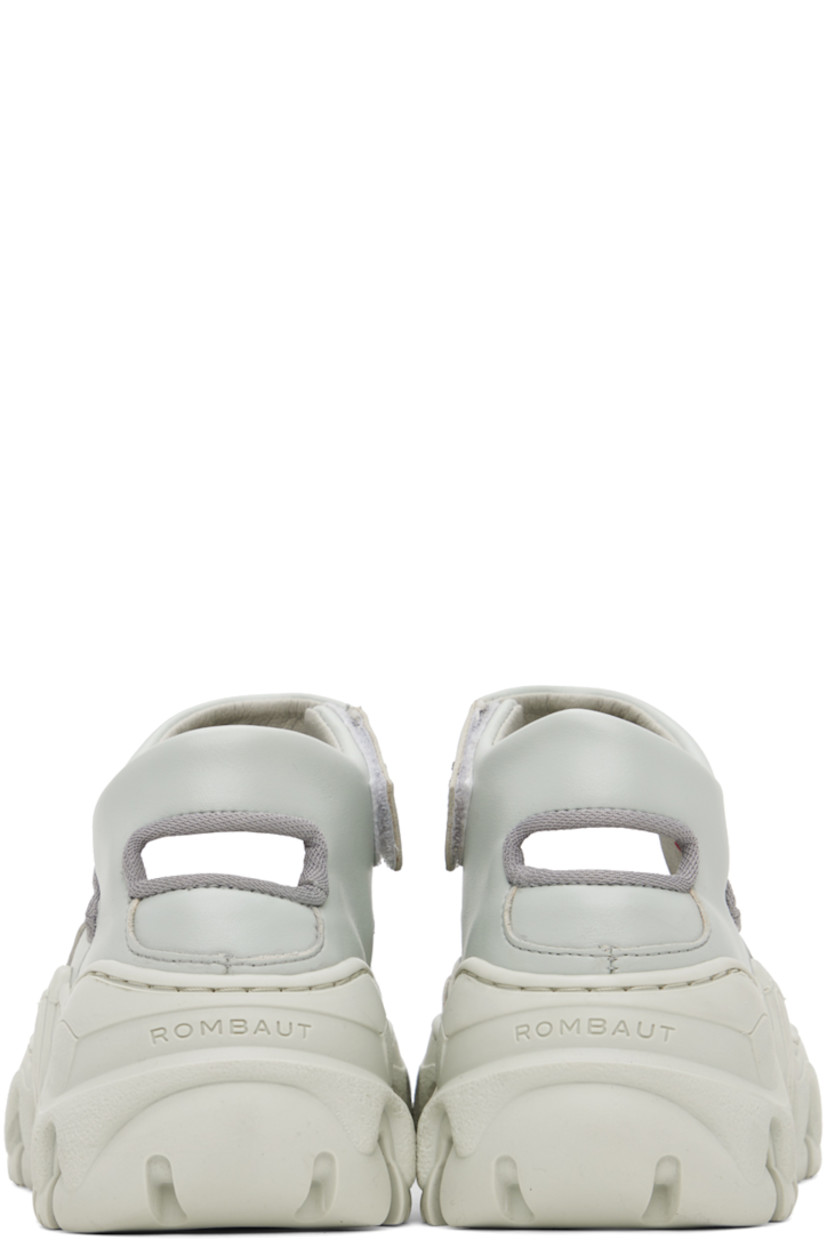 Handcrafted low-top paneled buffed faux-leather sneakers in gray.

· Velcro ankle strap
· Cutout at heel and outer side
· Mesh lining
· Treaded sculptural TPU platform sole
· Platform: H2"

Supplier color: Light grey