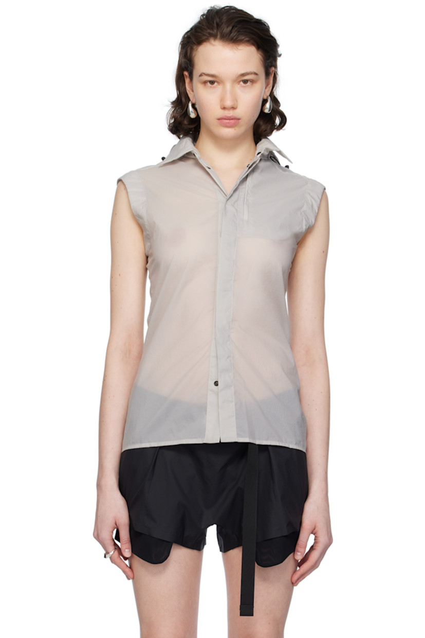 Semi-sheer recycled nylon ripstop vest. 

· Bungee-style drawstring at detachable hood
· Spread collar
· Concealed press-stud closure
· Zip pocket at chest
· Shirttail hem
· Zip vent at back

Supplier color: Light grey