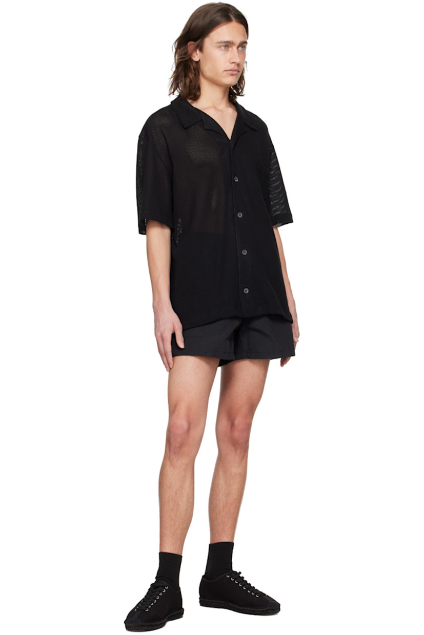 OEKO-TEX® Standard 100-certified cotton mesh shirt. Lightweight and breathable. 

· Open spread collar
· Button closure
· Patch pocket at chest
· Vented side seams 

Supplier color: Black