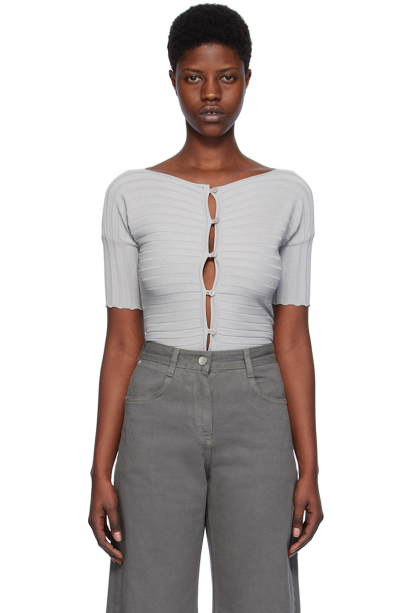 Rib knit rayon-blend cardigan. Rolled edges throughout.

· Boat neck
· Button closure
· Scalloped edge at cuffs
 
Supplier color: Silver