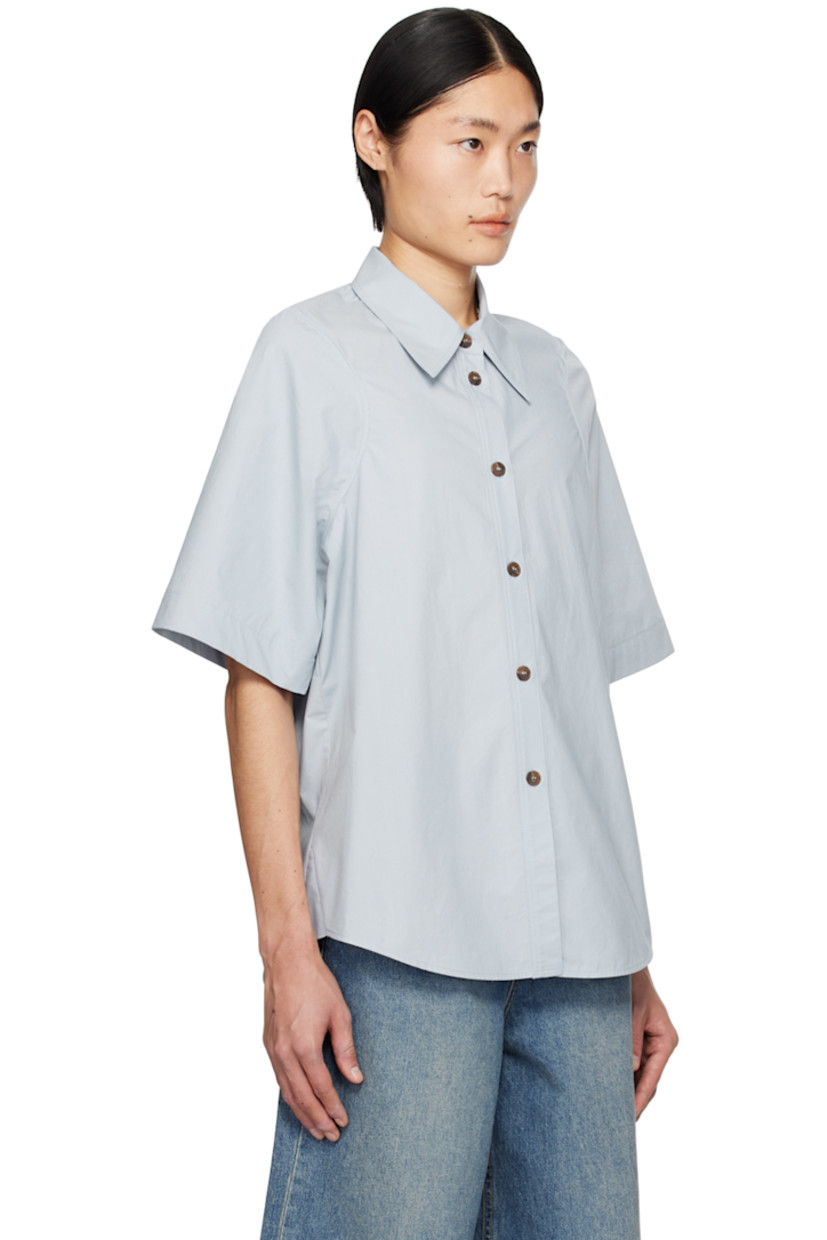 Cotton poplin shirt.

· Spread collar
· Button closure
· Shirttail hem

Supplier color: Blue