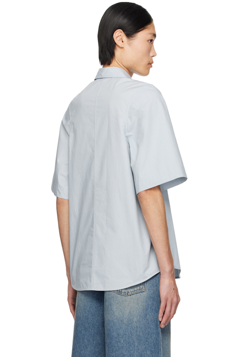 Cotton poplin shirt.

· Spread collar
· Button closure
· Shirttail hem

Supplier color: Blue