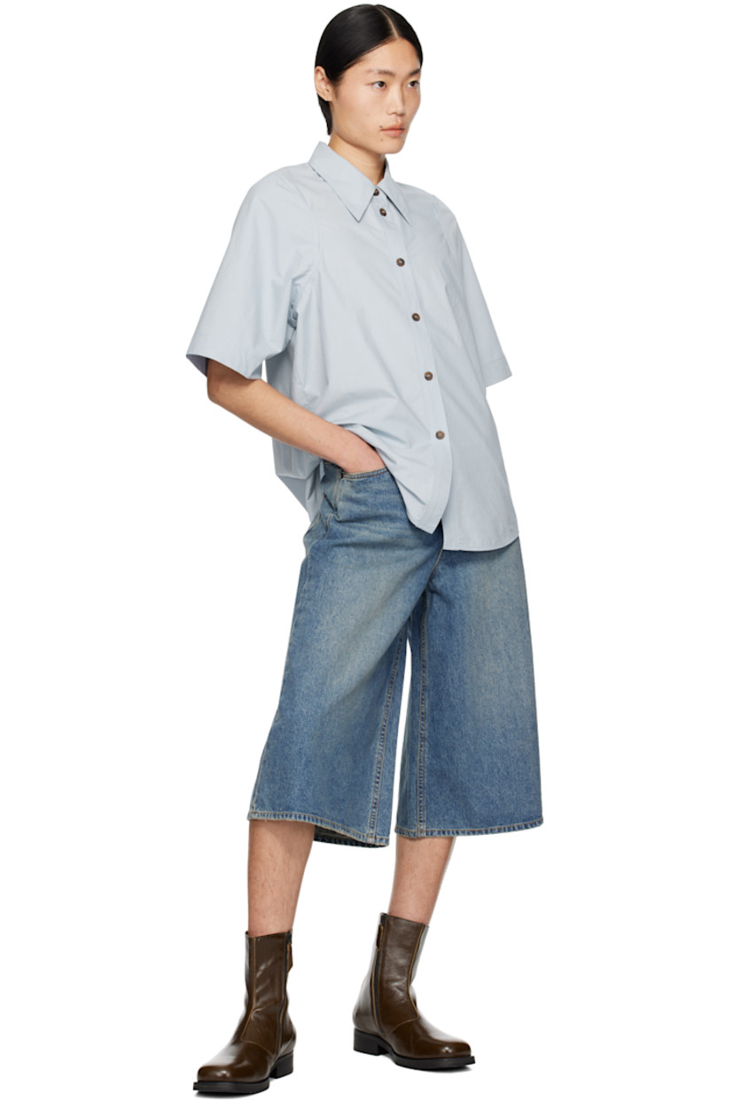Cotton poplin shirt.

· Spread collar
· Button closure
· Shirttail hem

Supplier color: Blue