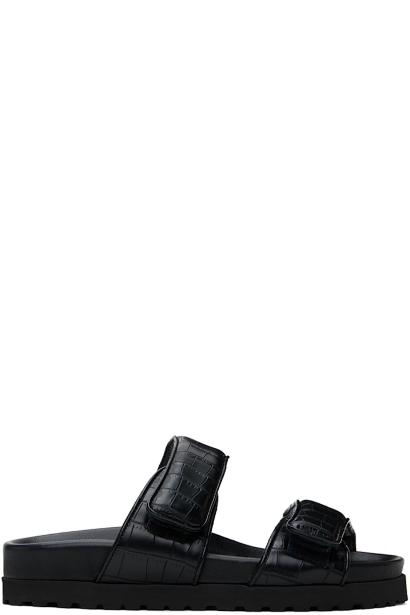 Croc-embossed faux-leather flat sandals in black.

· Open toe
· Padded velcro straps at vamp
· Logo embossed at molded footbed
· Foam rubber midsole
· Treaded rubber sole

Supplier color: Black