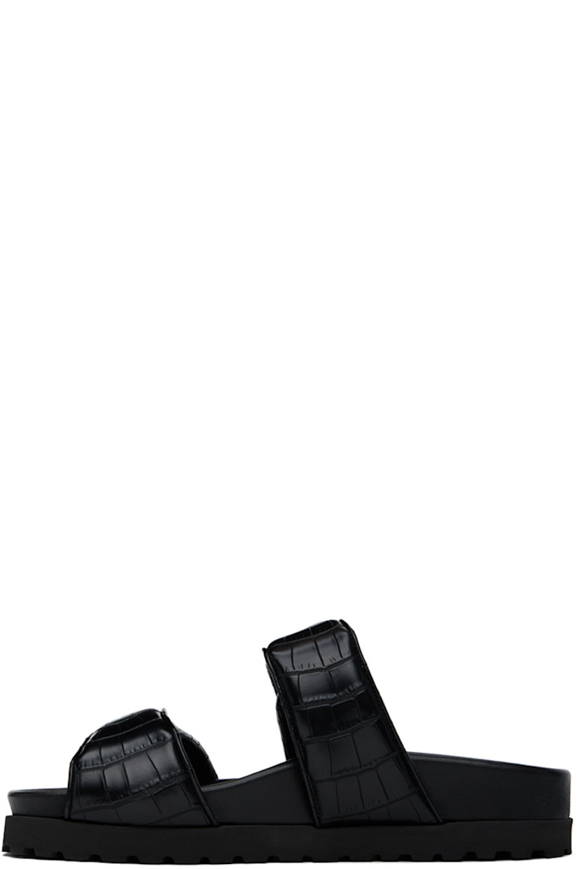 Croc-embossed faux-leather flat sandals in black.

· Open toe
· Padded velcro straps at vamp
· Logo embossed at molded footbed
· Foam rubber midsole
· Treaded rubber sole

Supplier color: Black