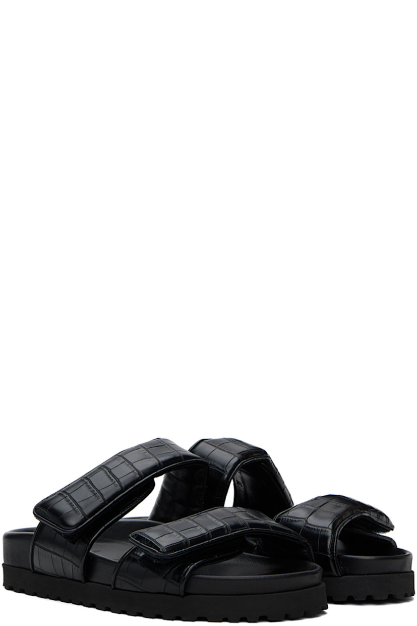 Croc-embossed faux-leather flat sandals in black.

· Open toe
· Padded velcro straps at vamp
· Logo embossed at molded footbed
· Foam rubber midsole
· Treaded rubber sole

Supplier color: Black
