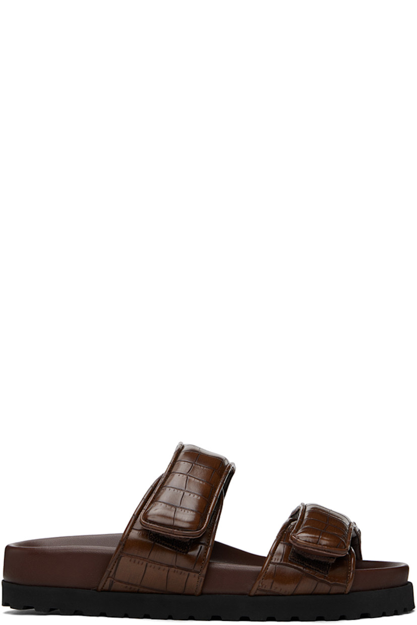 Croc-embossed faux-leather flat sandals in brown.

· Open toe
· Padded velcro straps at vamp
· Logo embossed at molded footbed
· Foam rubber midsole
· Treaded rubber sole

Supplier color: Chocolate