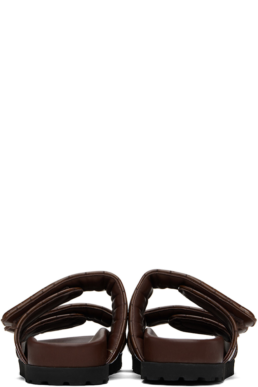 Croc-embossed faux-leather flat sandals in brown.

· Open toe
· Padded velcro straps at vamp
· Logo embossed at molded footbed
· Foam rubber midsole
· Treaded rubber sole

Supplier color: Chocolate
