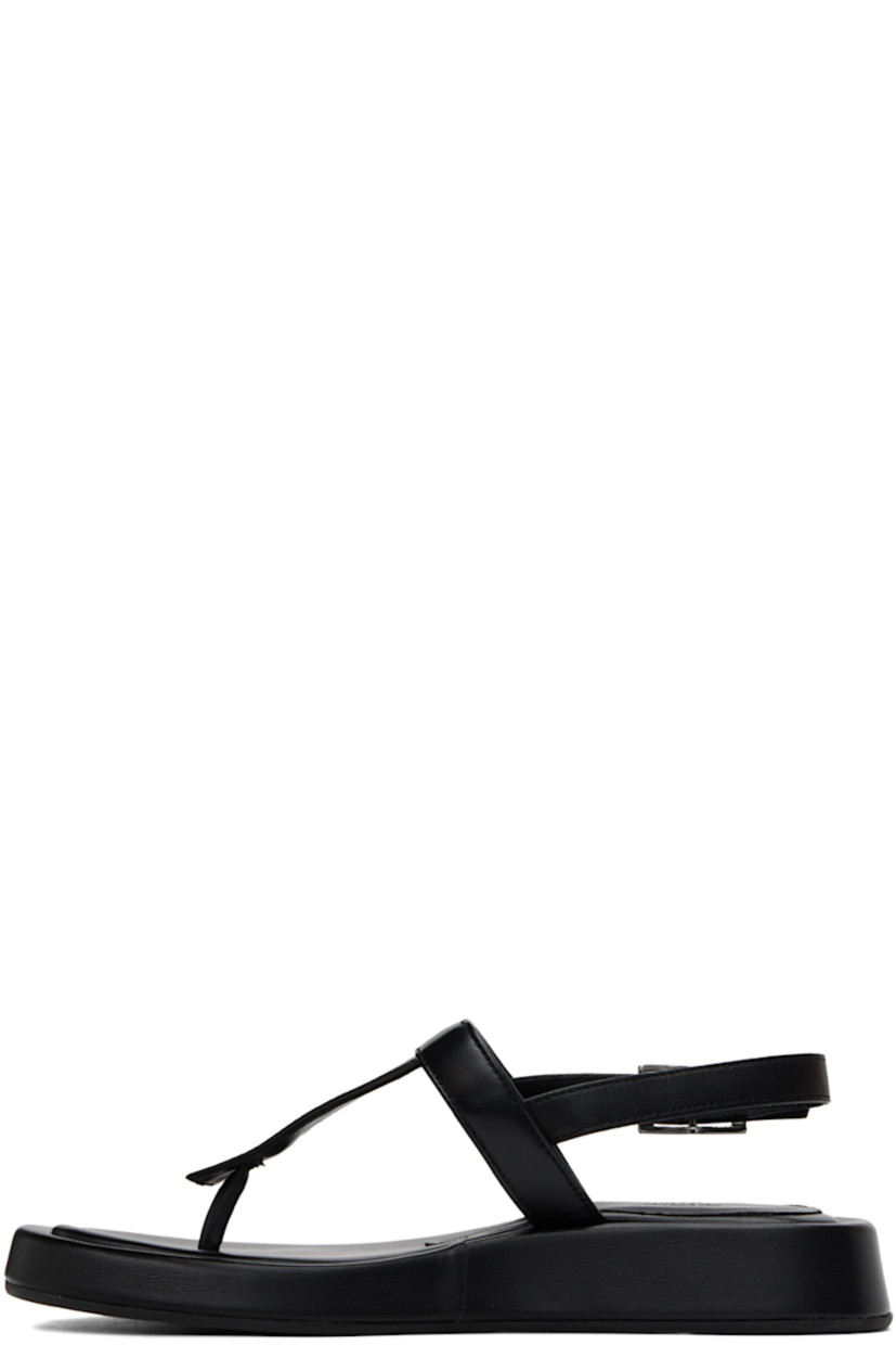 Grained leather flat sandals in black.

· Open square toe
· Thong-style strap at vamp
· Pin-buckle ankle strap
· Logo embossed at padded footbed
· Covered midsole
· Rubber sole

Supplier color: Black