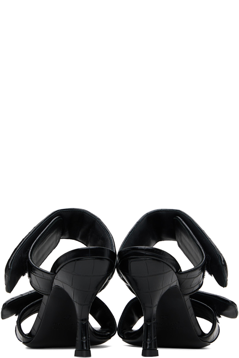 Croc-embossed faux-leather slip-on heeled sandals in black.

· Open square toe
· Padded velcro straps at vamp
· Logo embossed at footbed
· Covered stiletto heel with rubber injection
· Leather sole
· Heel: H3.75"

Supplier color: Black
