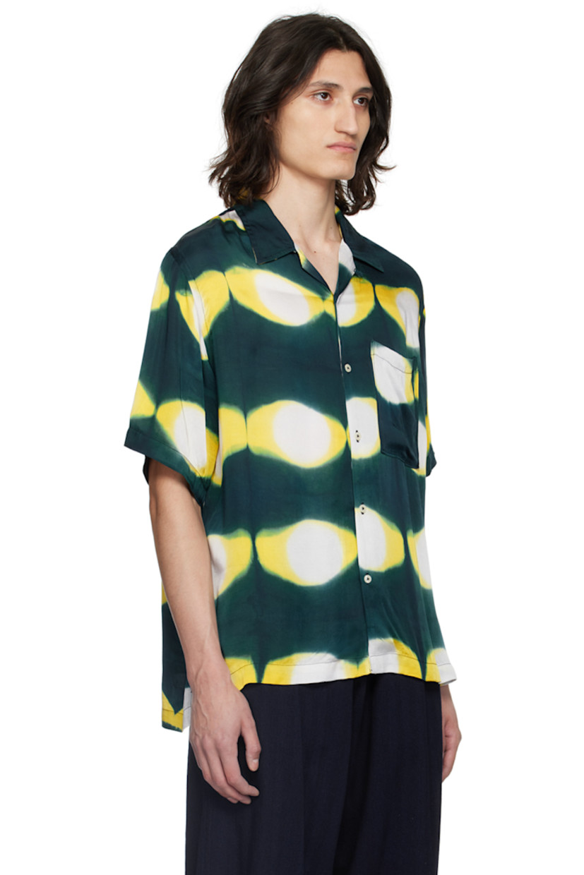 Plain-woven modal shirt. Hand-dyed graphic pattern throughout.

· Open spread collar
· Button closure
· Patch pocket at chest
· Tennis-tail hem

Each item is unique. Please note that coloration may vary.

Supplier color: Navy/Yellow