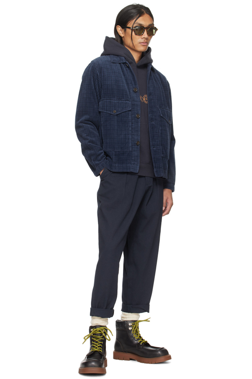 Cotton fleece hoodie.

· Logo printed at front
· Kangaroo pocket
· Rib knit hem and cuffs
· Graphic embroidered at sleeve
· Logo and text printed at back

Supplier color: Navy