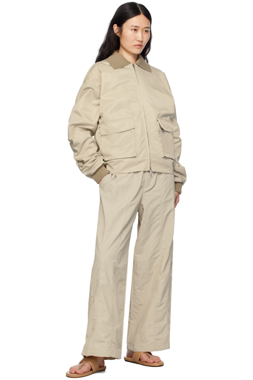Nylon taffeta trousers.

· Elasticized waistband
· Four-pocket styling
· Zip-fly
· Concealed bungee-style drawstring at cuffs

Supplier color: Stone