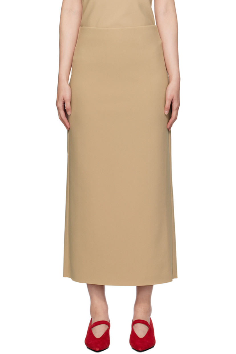 Stretch polyester bonded crepe skirt.

· Low-rise
· Elasticized waistband
· Central vent at back hem

Available exclusively at SSENSE.

Supplier color: Peanut