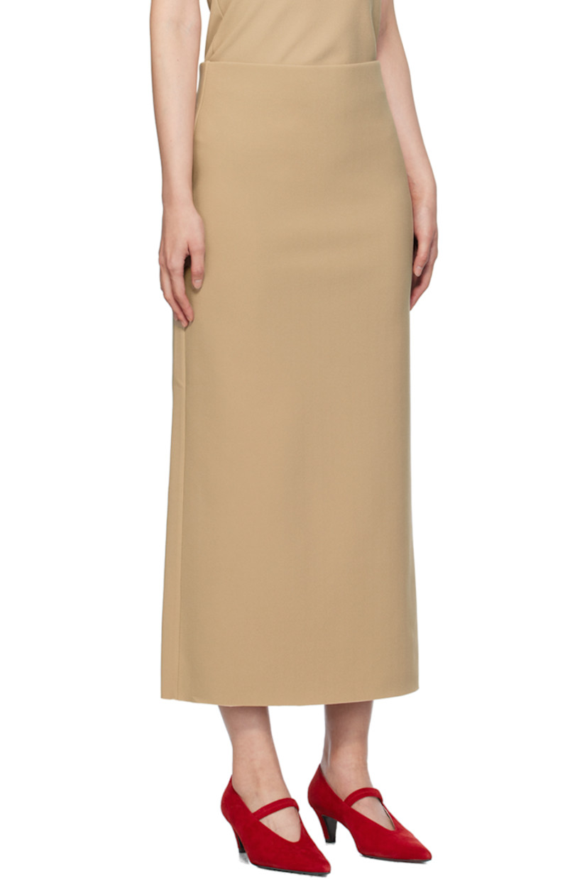 Stretch polyester bonded crepe skirt.

· Low-rise
· Elasticized waistband
· Central vent at back hem

Available exclusively at SSENSE.

Supplier color: Peanut