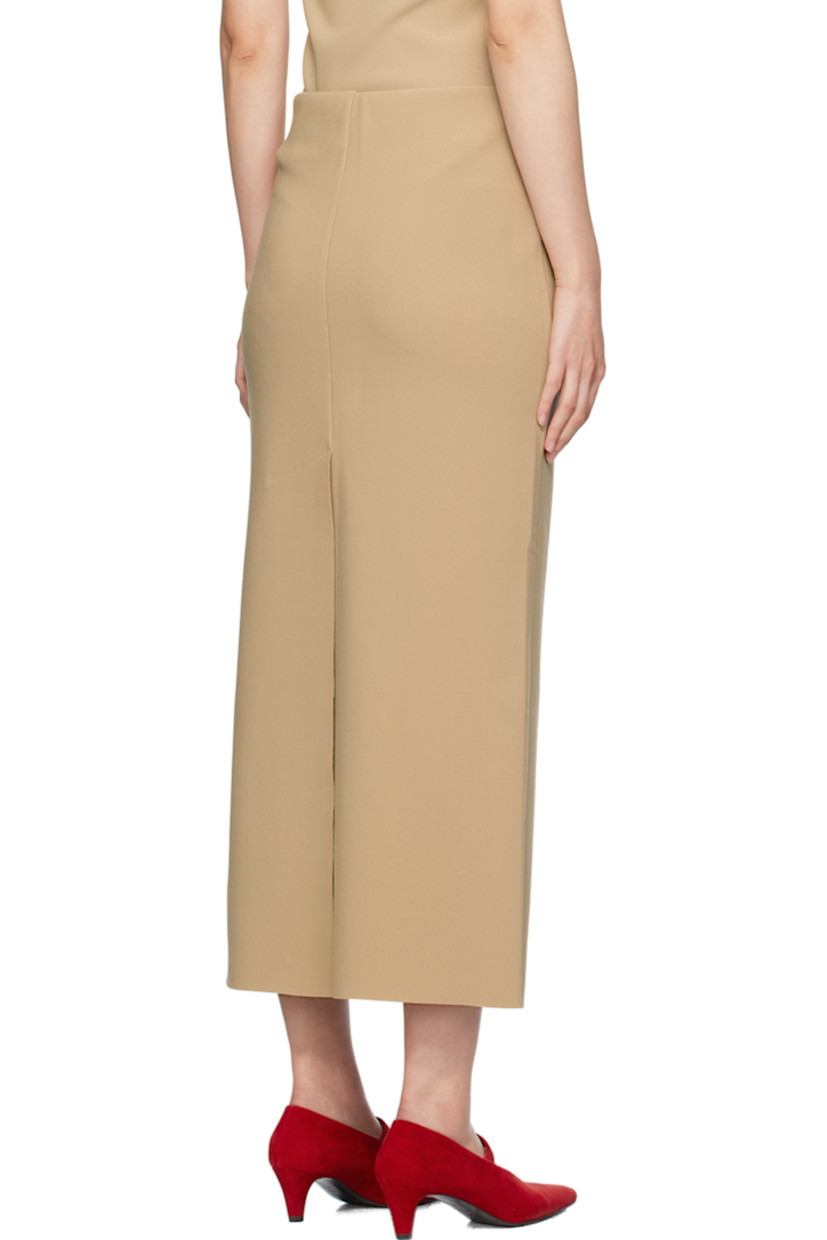 Stretch polyester bonded crepe skirt.

· Low-rise
· Elasticized waistband
· Central vent at back hem

Available exclusively at SSENSE.

Supplier color: Peanut