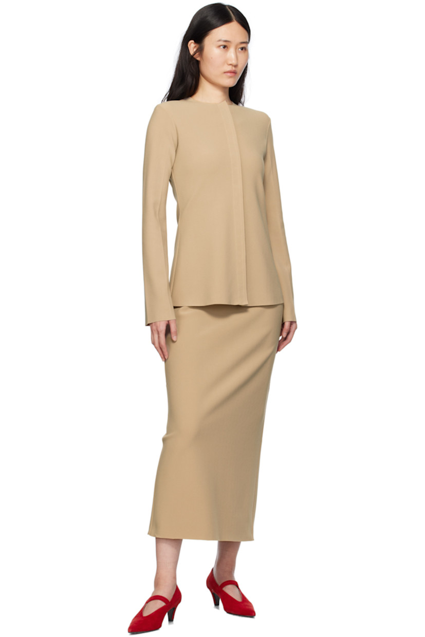 Stretch polyester bonded crepe skirt.

· Low-rise
· Elasticized waistband
· Central vent at back hem

Available exclusively at SSENSE.

Supplier color: Peanut