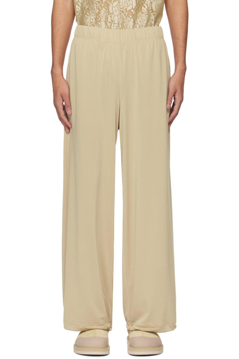 Stretch polyester crepe trousers. 

· Drawstring at elasticized waistband 
· Four-pocket styling
· Concealed bungee-style drawstring at cuffs

Supplier color: Peanut
