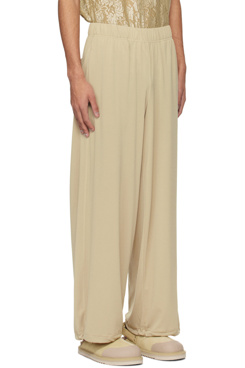 Stretch polyester crepe trousers. 

· Drawstring at elasticized waistband 
· Four-pocket styling
· Concealed bungee-style drawstring at cuffs

Supplier color: Peanut