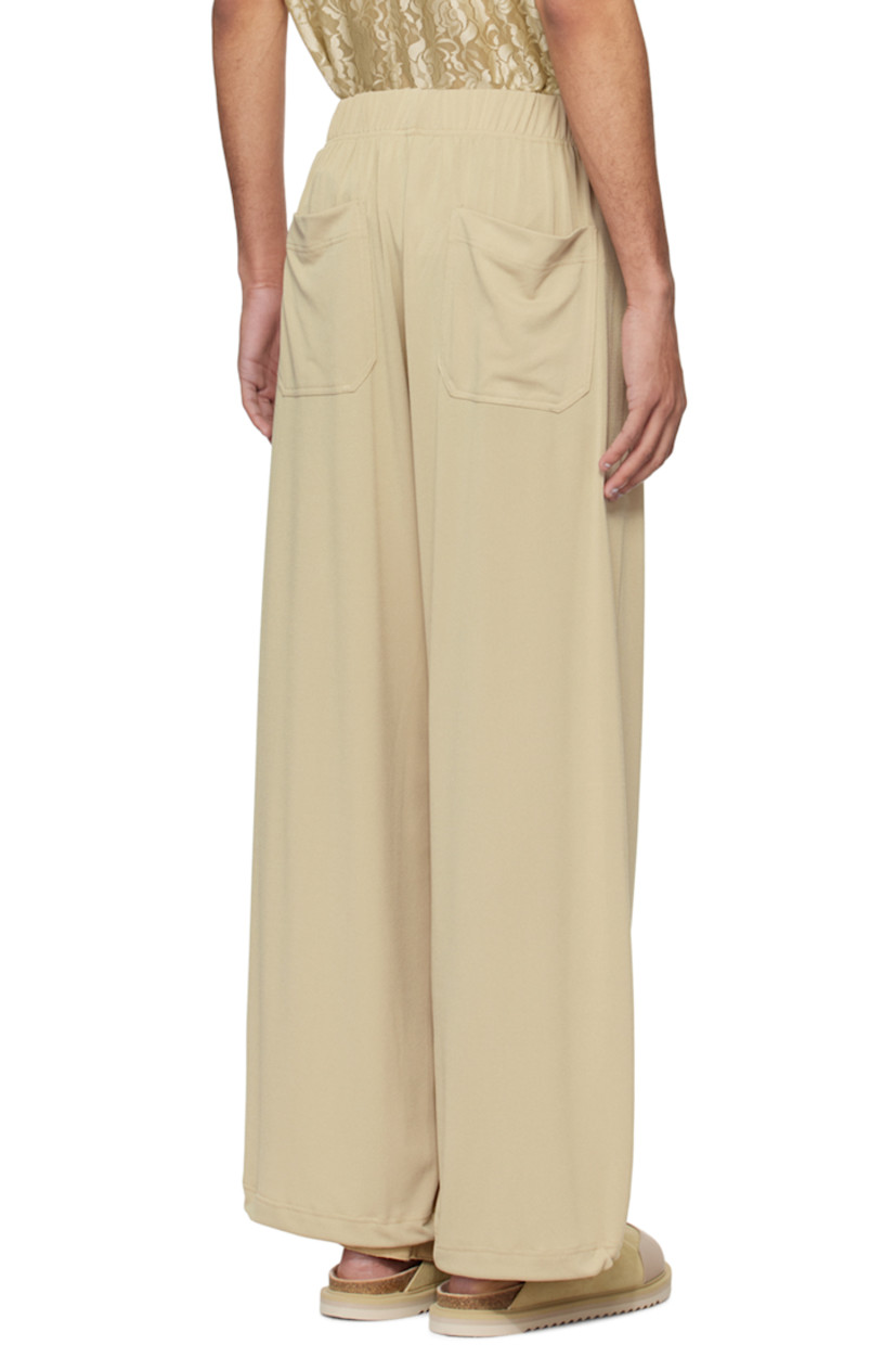 Stretch polyester crepe trousers. 

· Drawstring at elasticized waistband 
· Four-pocket styling
· Concealed bungee-style drawstring at cuffs

Supplier color: Peanut