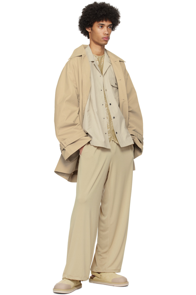 Stretch polyester crepe trousers. 

· Drawstring at elasticized waistband 
· Four-pocket styling
· Concealed bungee-style drawstring at cuffs

Supplier color: Peanut