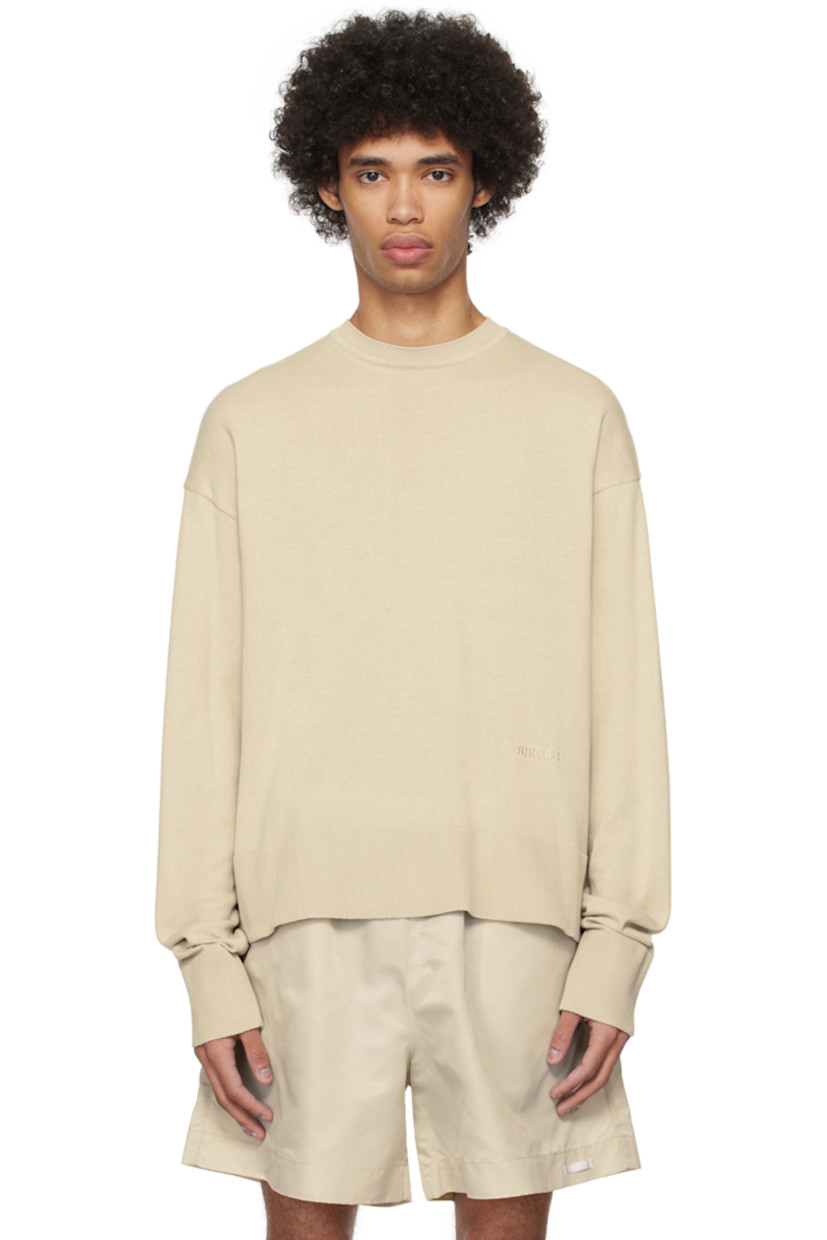 Knit BCI-certified cotton sweater.

· Rib knit crewneck, hem, and cuffs
· Logo embroidered front
· Dropped shoulders

Supplier color: Smoke bone
