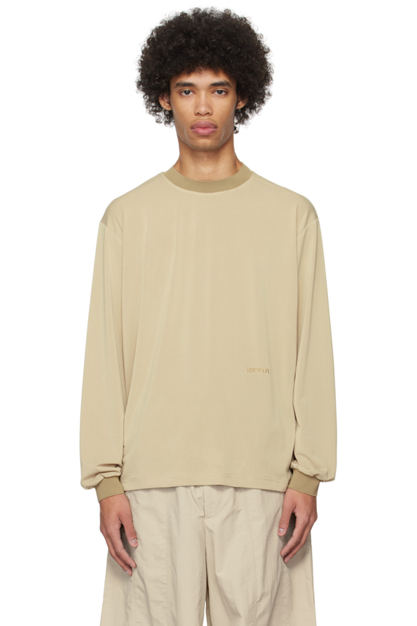 Stretch polyester crepe T-shirt. 

· Rib knit crewneck and cuffs 
· Logo embroidered at front
· Dropped shoulders

Supplier color: Peanut