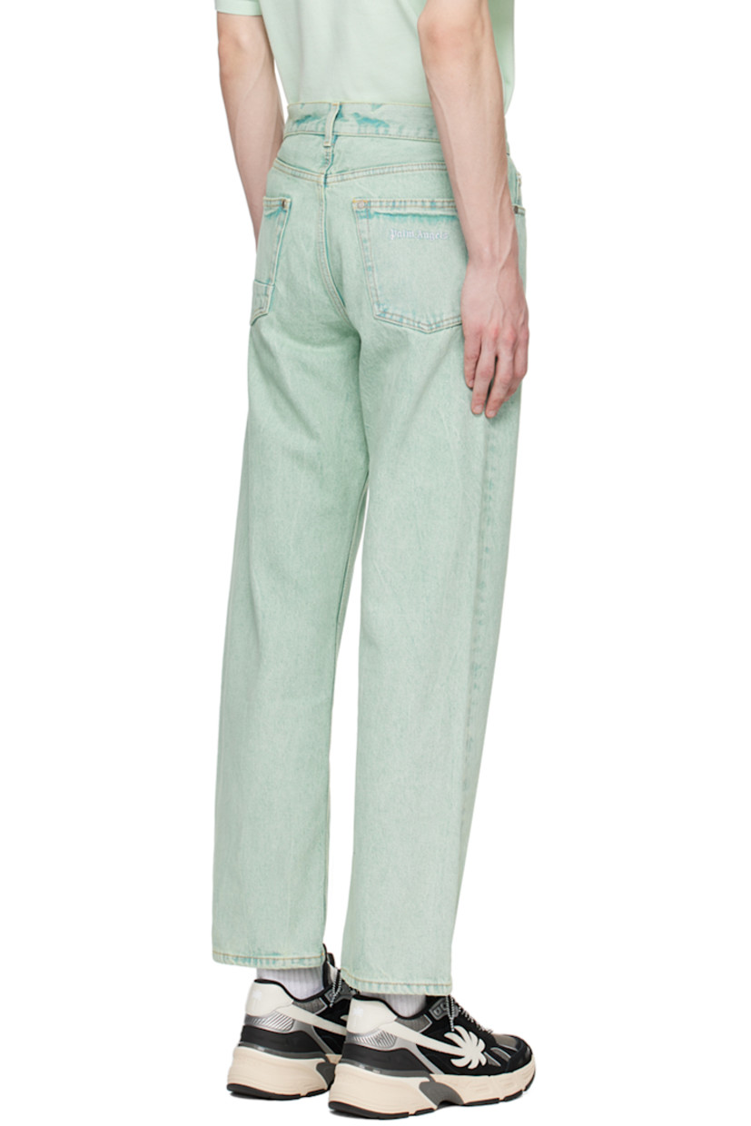 Overdyed non-stretch denim jeans. Fading and subtle distressing throughout. 

· Belt loops 
· Five-pocket styling
· Button-fly
· Logo embroidered at back pocket
· Logo-engraved silver-tone hardware
· Contrast stitching in tan 

Supplier color: Mint/Off-white