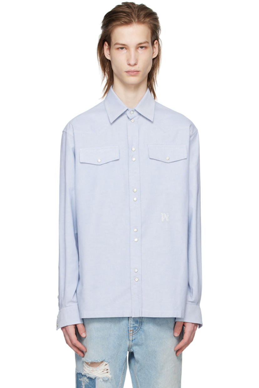 Plain-woven cotton shirt.

· Spread collar
· Press-stud closure 
· Flap pockets at chest
· Logo embroidered at front
· Press-stud fastening at barrel cuffs 

Supplier color: Light blue