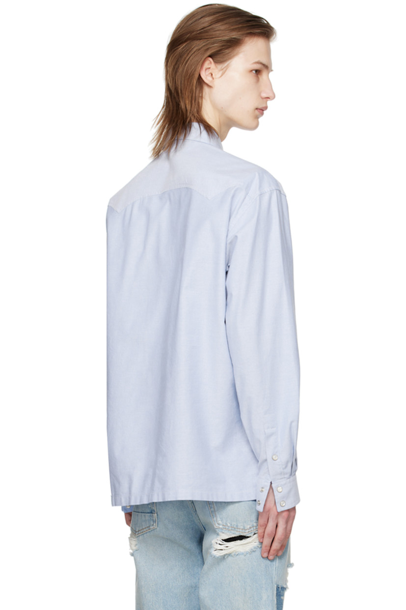 Plain-woven cotton shirt.

· Spread collar
· Press-stud closure 
· Flap pockets at chest
· Logo embroidered at front
· Press-stud fastening at barrel cuffs 

Supplier color: Light blue