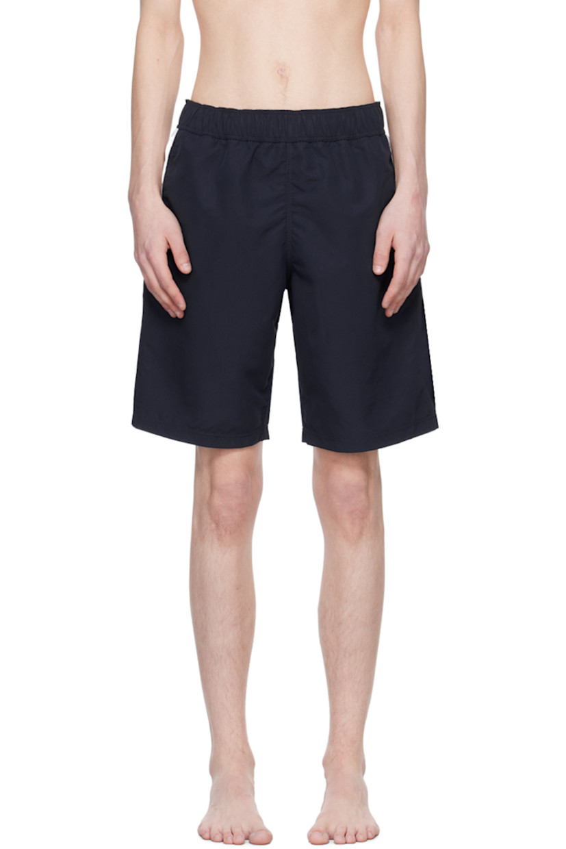 Polyester taffeta swim shorts. 

· Concealed drawstring at elasticized waistband
· Two-pocket styling
· Logo printed at back
· Briefs-style mesh lining

Supplier color: Navy blue/Off white