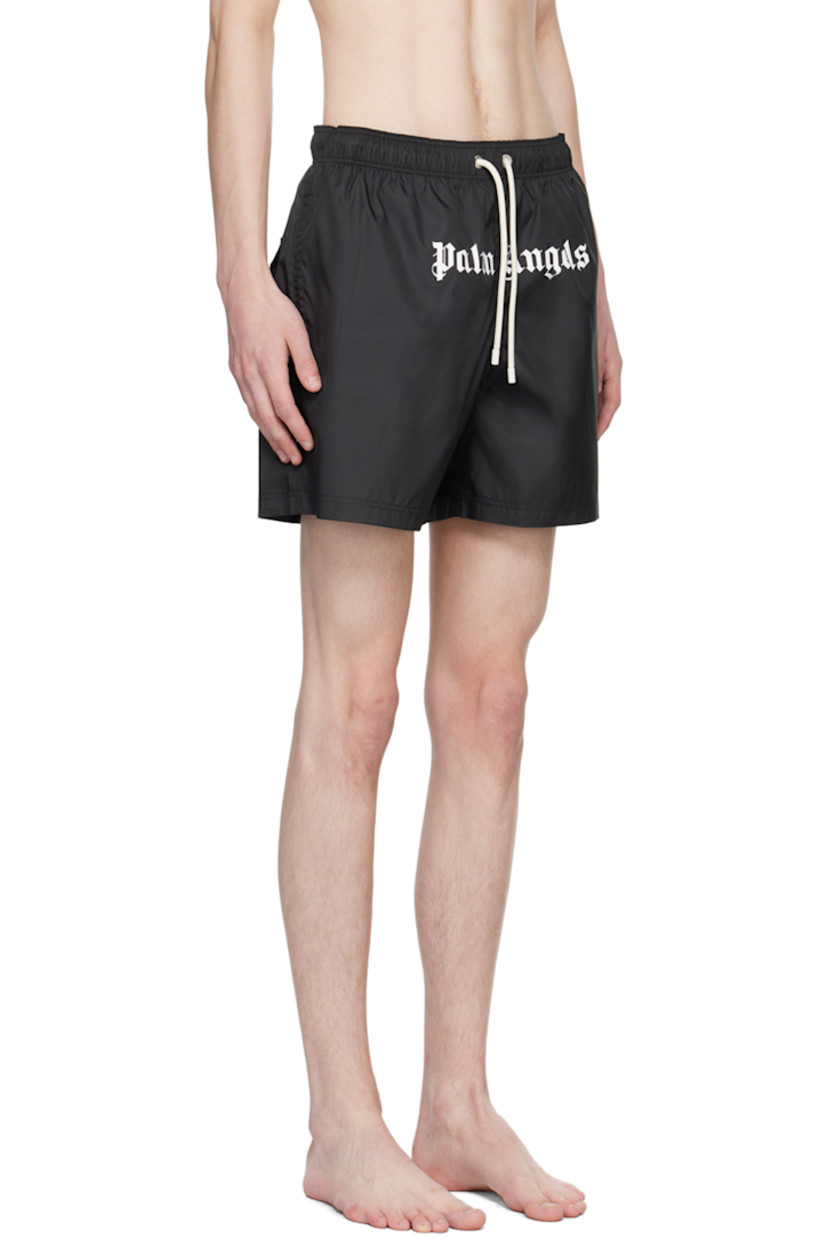 Polyester taffeta swim shorts. 

· Drawstring at elastisized waistband 
· Three-pocket styling
· Logo printed at front
· Eyelet at back
· Partial mesh lining

Supplier color: Black/White